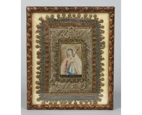A framed 19th century portrait miniature of the Mater Dolorosa in raised gold thread embroidered mount, 9cm x 6cm.   Conditio