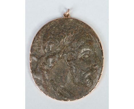 A carved oval serpentine cameo in notched yellow metal mount. Profile portrait of Antiochus IX of Syria (135-96BC), inscribed