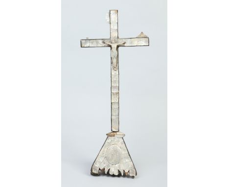 A Continental mother of pearl corpus Christi incised with religious subjects, 57cm.   Condition Report. To be used as a guide