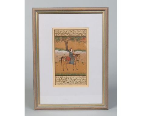 A framed Persian manuscript page, with two bands of text framing a painted gouache scene of a mounted falconer, 20.5cm x 11.5
