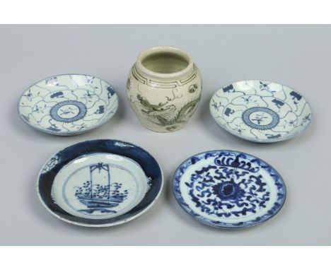 A pair of Chinese Kangxi (1662-1772) dishes painted in underglaze blue with panels and sprigs, two similar provincial Ming di