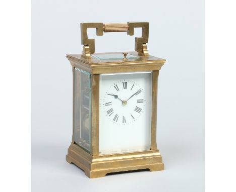 A 19th century French brass cased carriage clock. With enamel dial and housing a twin train movement with platform escapement