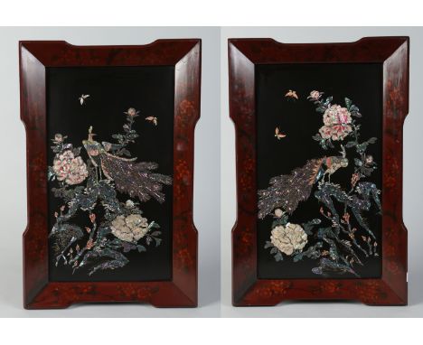 A pair of early 20th century Chinese lacquered convex panels in shaped lacquered frames. Inlaid with mother of pearl and abal