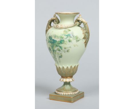 A Royal Worcester twin handled pedestal vase with moulded swags and acanthus leaves. Decorated on a pale matt green ground wi