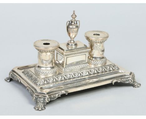 A Victorian silver desk stand by Henry Wilkinson & Co. With central sarcophagus box having urn shaped finial and flanked by a