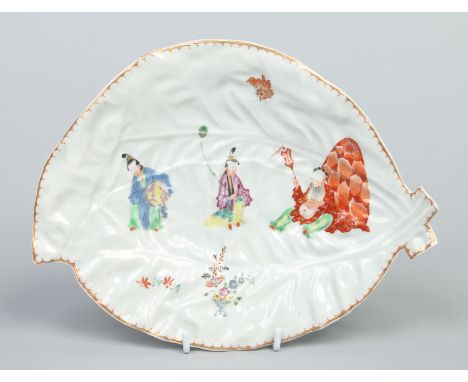 A Worcester cos lettuce leaf shaped dish. Decorated in coloured enamels with the Pu Tai pattern, c1772, 26cm wide.   Conditio
