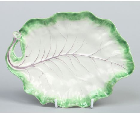A Worcester naturalistic leaf moulded dish with scrolling looped handle. Edged in green enamel and with puce veins, c1758, 21