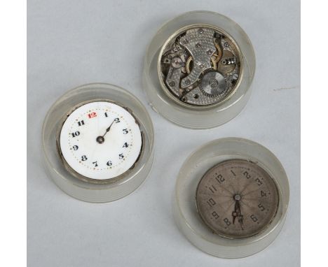 Three vintage Rolex watch movements. 