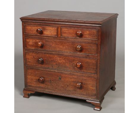 An early 19th century mahogany miniature straight front chest of two over three drawers. With reeded mouldings, cock beading 