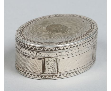 A 19th century Continental white metal oval snuff box with hinged cover and decorated with engine turned engraving, 6.25cm wi