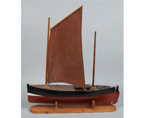 A radio controlled single mast pond yacht on pine stand, 80cm bow o stern.