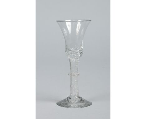 An 18th century wine glass with bell shaped bowl raised on an airtwist stem with vermicular collar, 15.5cm.   Condition Repor