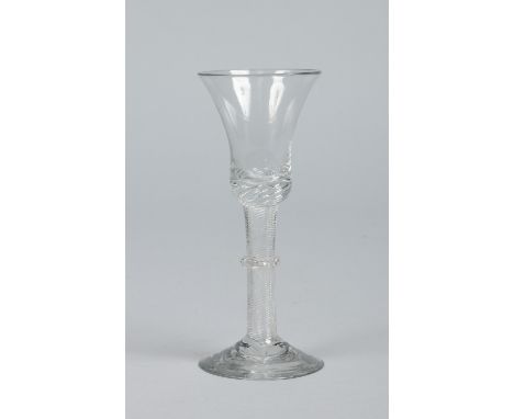 An 18th century wine glass with bell shaped bowl raised on an airtwist stem with vermicular collar, 15.5cm.   Condition Repor