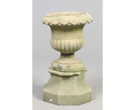 A Victorian carved stone campana planter on spreading octagonal plinth, 50cm.