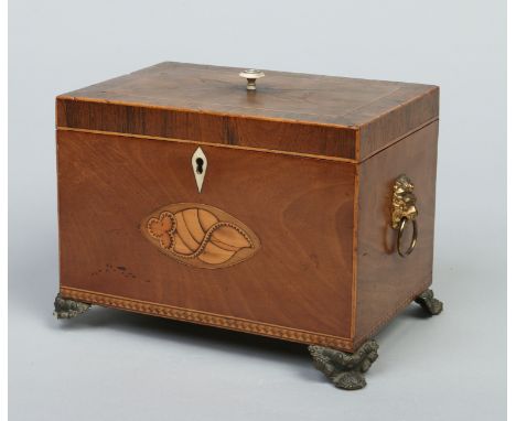 A Regency mahogany tea caddy. Crossbanded, with inlaid shell patera and having gilt metal mounts, 21cm wide.   Condition Repo