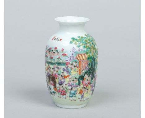 A Chinese Republic period specimen vase. Decorated in coloured enamels with a large group of children in a landscape. Printed