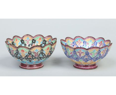Two Persian fluted enamel bowls. Decorated with bands of ground colour and trailing flowers, 12.5cm wide.    Condition Report
