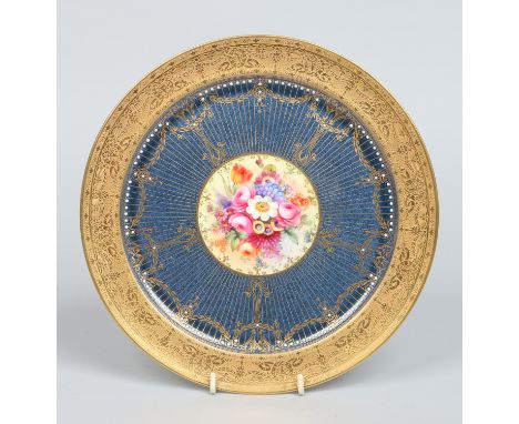 A Royal Worcester cabinet plate probably painted by J. Stanley with a central roundel of flowers under a wide powder blue bor