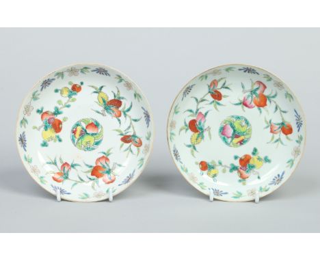 A pair of Chinese Daoguang (1821-1850) dishes decorated in polychrome enamels with peaches, pomegranates and pineapples. Red 