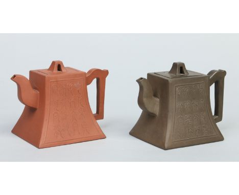 Two Chinese yixing teapots of square tapering form and each moulded with a panel of character marks, impressed seal marks to 