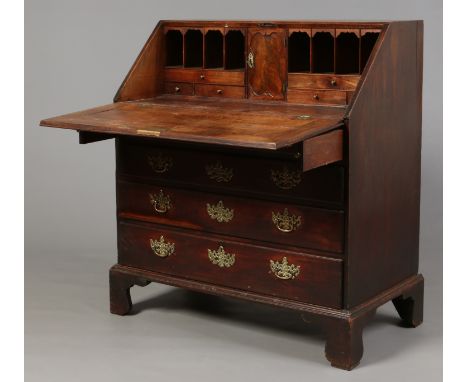 A George II mahogany bureau. With fitted interior, having four graduated drawers and raised on bracket feet, 1m 3cm high, 91.