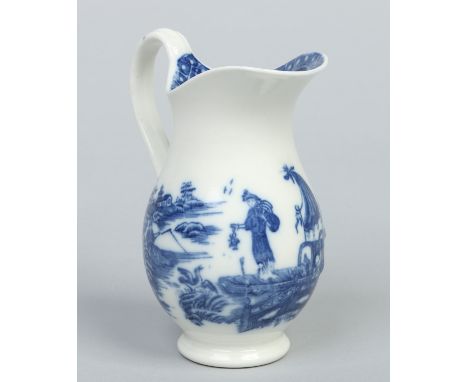 A Caughley helmet shaped cream jug with reeded scrolling handle. Printed in underglaze blue with the Fisherman and Cormorant 