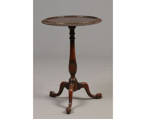 A 20th century Chippendale style mahogany tripod wine table. 