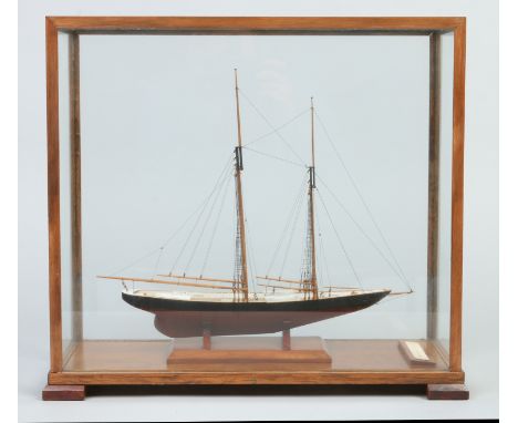 A model of a schooner housed in a display case; Grand Banks Schooner, case 43cm wide.