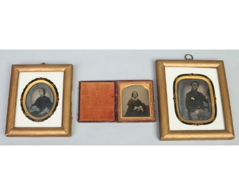 A Victorian cased daguerreotype, portrait of a woman along with two other gilt framed examples each in gilt and jewelled moun
