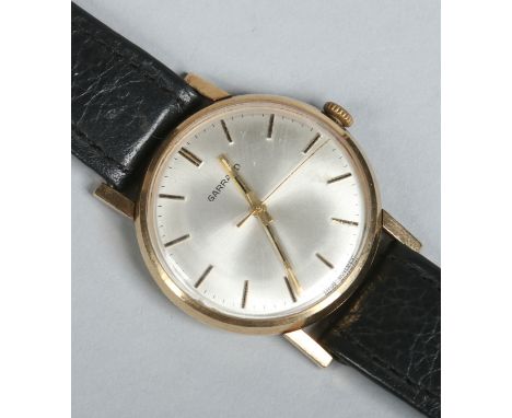 A gentleman's 9 carat gold cased Garrard manual wristwatch. With satin dial, centre seconds and baton markers, 32mm wide.   C