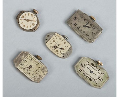 Five vintage Rolex watch movements. 