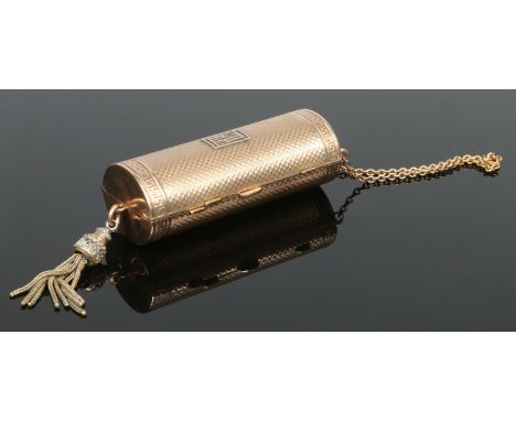 A 9 carat gold cylindrical powder compact with three internal compartments by Asprey. With engine turned engraving, Greek key