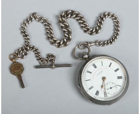 A Victorian silver cased pocket watch with single Albert chain, T bar and key. With enamel dial having subsidiary seconds and