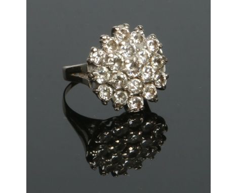 An 18 carat gold diamond cluster ring set with 19 round cut diamonds approximately 0.2ct each. Size K.   Condition Report. To