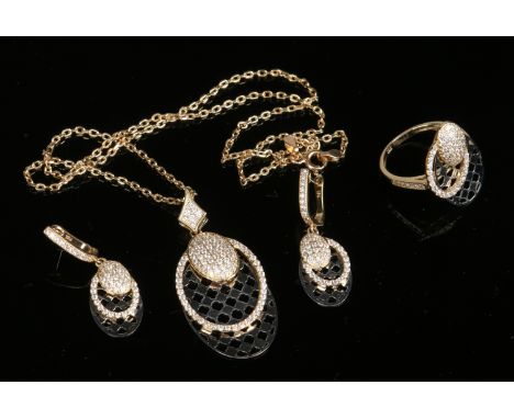 A suite of 18 carat yellow and white gold jewellery pave set with diamonds and with oval chequered pierced panels. Comprising