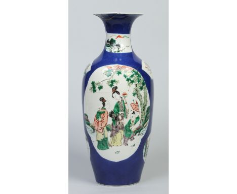 A 19th century Chinese Kangxi style baluster vase. Powder blue ground and enamelled in reserves with figures and landscapes, 