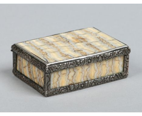 An 18th century mammoth tooth snuff box with white metal mounts and lined in tortoiseshell, 7cm wide.   Condition Report. To 