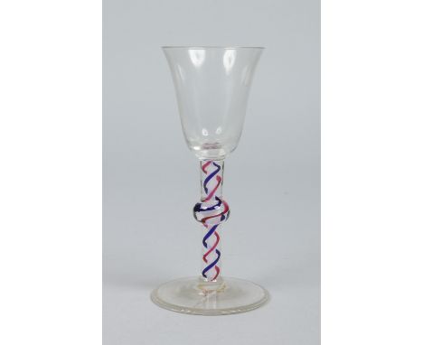 A Georgian wine glass with flared bowl raised on a knopped coloured and opaque twist stem, 15.5cm.   Condition Report. To be 