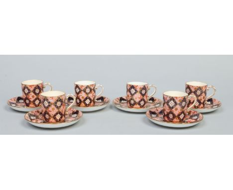 A set of six Mintons coffee cans and saucers decorated in the Imari style. Printed green and impressed marks, date code for 1