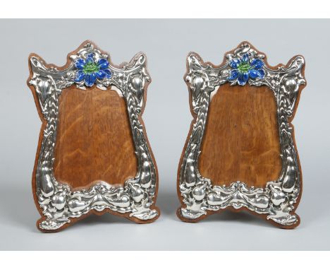 A large pair of matched Art Nouveau silver eizel photograph frames, one by George Nathan & Ridley Hayes, the other H. Emanuel