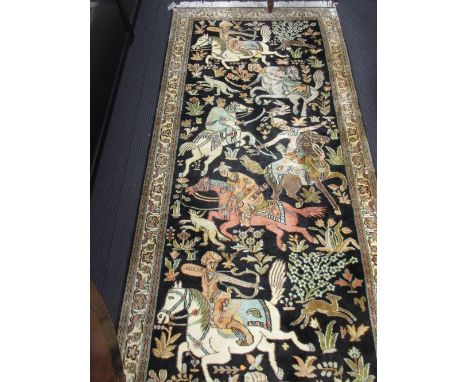 A Persian runner carpet worked with hunting scenes on a cream and black ground, 15ft x 3ft  