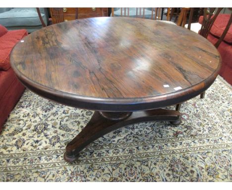 A William IV rosewood circular top breakfast table, on pillar support and platform base 137cm diameter  