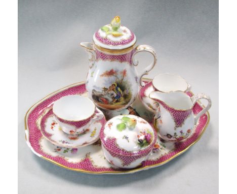 A Vienna porcelain cabaret set, each piece painted with Watteauesque vignettes of courting couples and supported by scattered