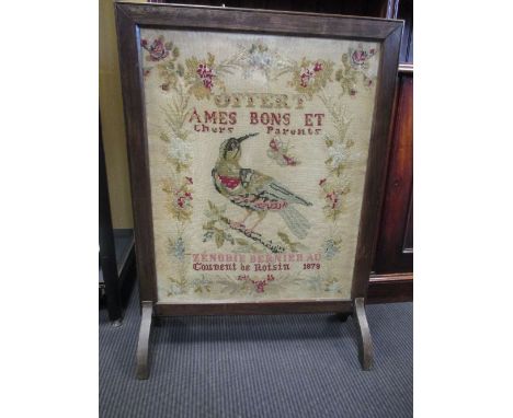 A needleworked fire screen, 87cm high and 64cm wide  