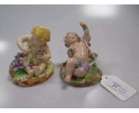 A Dorothy Doughty Royal Worcester porcelain figure of a boy and another similar figurine (2)  