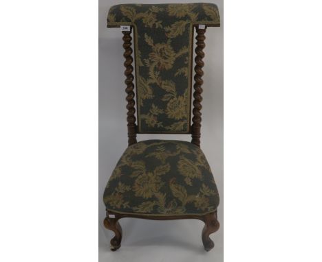 A Victorian walnut upholstered prie dieu chair on cabriole legs with ceramic casters, 94cm high Condition Report: Available u