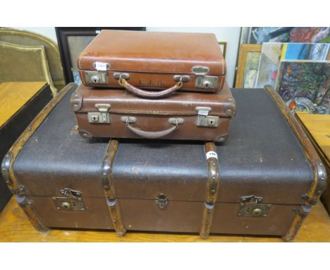 A wood bound travel trunk and two small suit cases (3) Condition Report: Available upon request