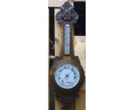 A Victorian carved oak barometer/thermometer Condition Report: Available upon request