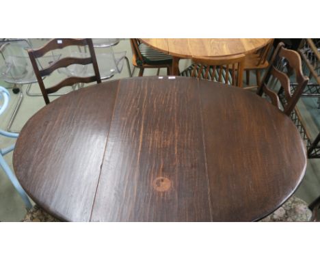 A 20th century drop leaf dining table 73cm high,136cm wide and 106cm deep. A four ladder back dining chairs.(5) Condition Rep