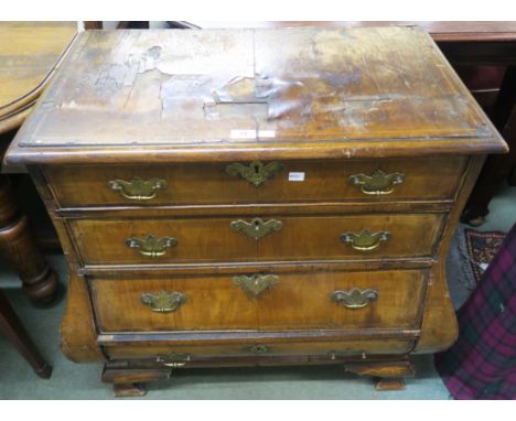 A 19th century walnut veneered four drawer bombe commode on bracket feet (Muirhead Moffat &amp; Co) 82cm high, 87cm wide and 